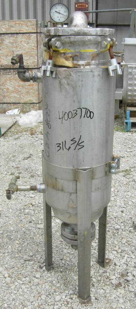 Used Basket Strainer Filter, 316 stainless steel. Jacketed chamber approximately 8" diameter x 29" deep. Flat bolt down top cover. 2" inlet/outlet. Removable basket 7" diameter x 28 1/2" deep.