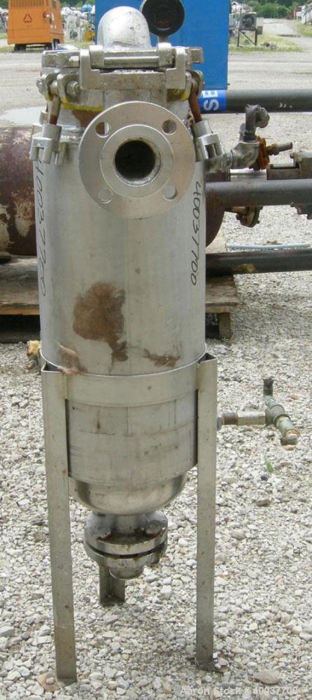 Used Basket Strainer Filter, 316 stainless steel. Jacketed chamber approximately 8" diameter x 29" deep. Flat bolt down top cover. 2" inlet/outlet. Removable basket 7" diameter x 28 1/2" deep.