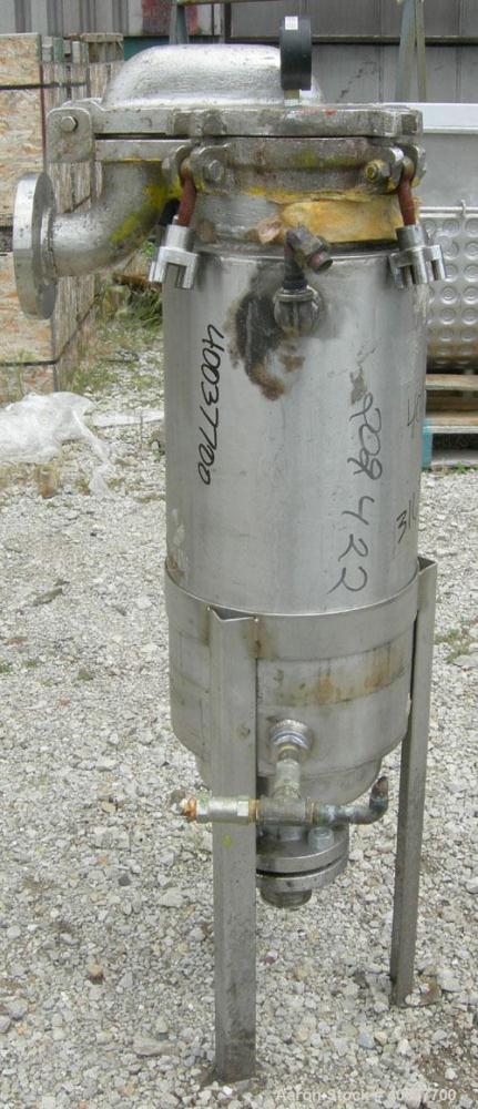 Used Basket Strainer Filter, 316 stainless steel. Jacketed chamber approximately 8" diameter x 29" deep. Flat bolt down top cover. 2" inlet/outlet. Removable basket 7" diameter x 28 1/2" deep.