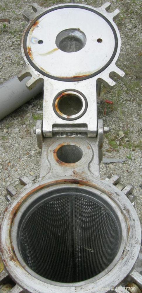 Used Basket Strainer Filter, 316 stainless steel. Jacketed chamber approximately 8" diameter x 29" deep. Flat bolt down top cover. 2" inlet/outlet. Removable basket 7" diameter x 28 1/2" deep.