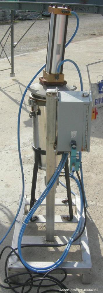 Used Vertical cartridge filter, stainless steel construction, 8 in ID with air cylinder for lid.