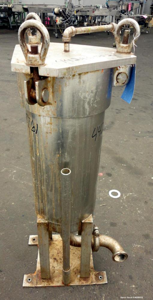 Used- Filtration Filter, 316 Stainless Steel. 9” Diameter 21” long. Approximate 2” inlet/outlet. Screw down top cover. Mount...