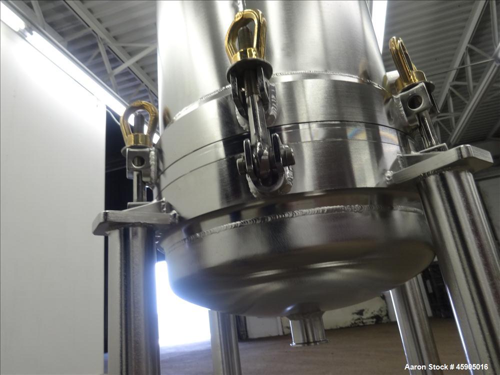Unused- Pall Filter Housing, Part#4HD4886-2869, 316L Stainless Steel. Approximate 13-3/4" diameter x 46" straight side, dished clamp on top and bottom. Internal rated 100 psi at -20 to 250 degrees F....