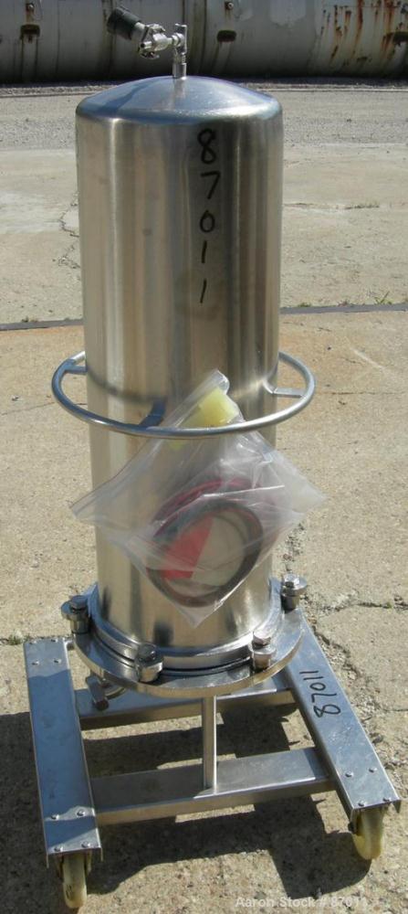 Used Valex Filter Housing, 316 Stainless Steel. 12-3/8" diameter x 35" straight side. Dish top, flat bolt-on bottom. 1-1/2" Inlet/outlet. Mounted on a stainless steel cart with casters.