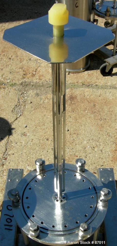 Used Valex Filter Housing, 316 Stainless Steel. 12-3/8" diameter x 35" straight side. Dish top, flat bolt-on bottom. 1-1/2" Inlet/outlet. Mounted on a stainless steel cart with casters.