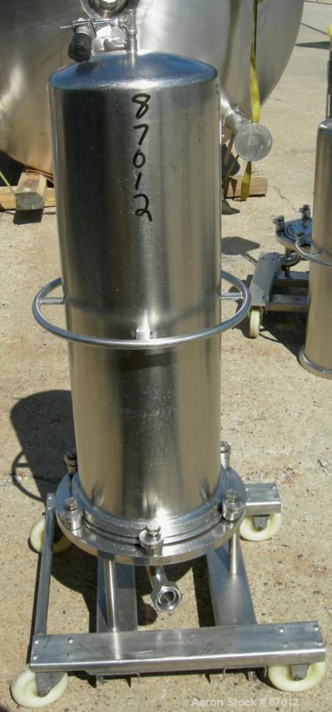 Used Valex Filter Housing, 316 Stainless Steel. 12-3/8" Diameter x 35" straight side. Dish top, flat bolt-on bottom. 1-1/2" Inlet/outlet. Mounted on a stainless steel cart with casters.