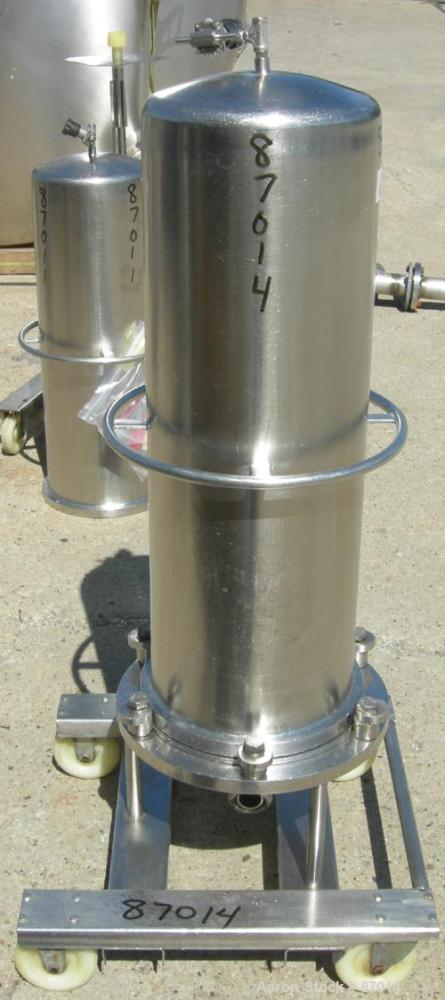 Used Valex Filter Housing, 316 Stainless Steel. 12-3/8" Diameter x 35" straight side. Dish top, flat bolt-on bottom. 1-1/2" Inlet/outlet. Mounted on a stainless steel cart with casters.