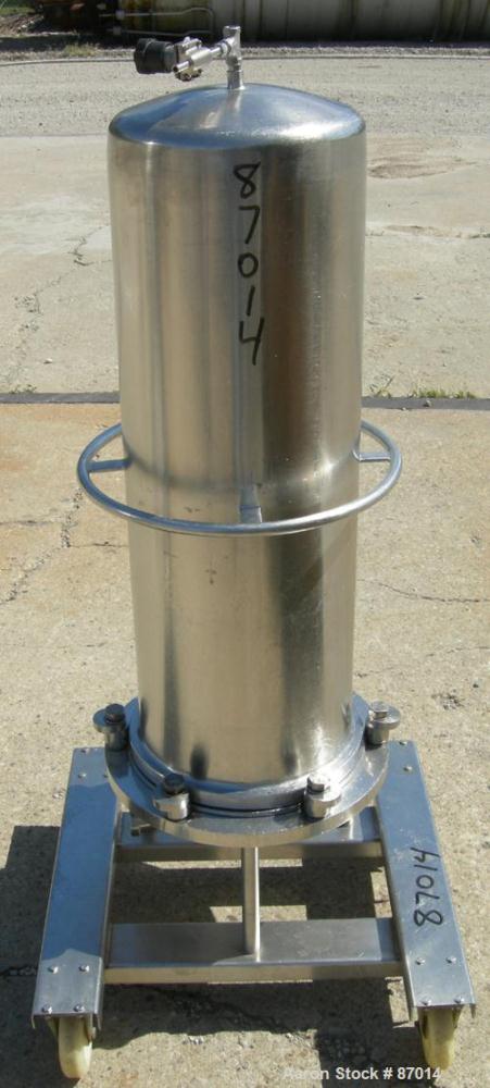 Used Valex Filter Housing, 316 Stainless Steel. 12-3/8" Diameter x 35" straight side. Dish top, flat bolt-on bottom. 1-1/2" Inlet/outlet. Mounted on a stainless steel cart with casters.