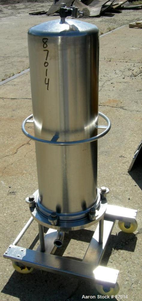 Used Valex Filter Housing, 316 Stainless Steel. 12-3/8" Diameter x 35" straight side. Dish top, flat bolt-on bottom. 1-1/2" Inlet/outlet. Mounted on a stainless steel cart with casters.