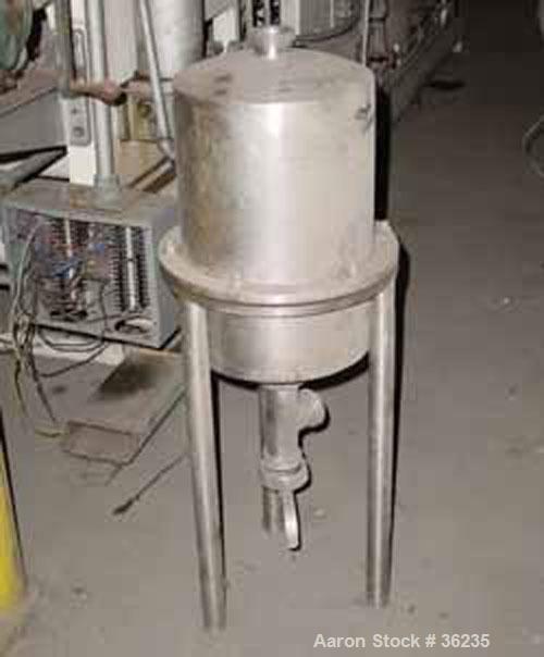 Used W.M. Sprinkman Raw Milk Filter, Stainless Steel. 12" Diameter x approximately 18" straight side, dish top and bottom. 2 section body. 2" diameter inlet/outlet. Mounted on 3 stainless steel legs.