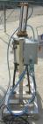 Used Vertical cartridge filter, stainless steel construction, 8 in ID with air cylinder for lid.