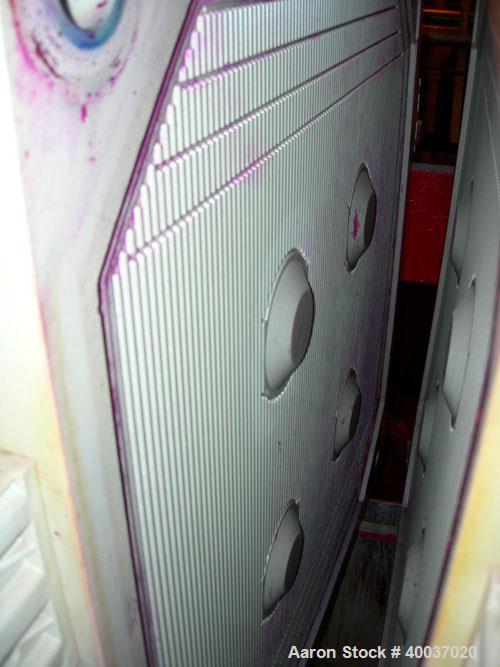 Used: Filter Press, 47" x 47". (51) 2 1/2" thick polypropylene plates, 1/2" recess. (1) head, (1) tail plate. 4 corner feed. Approximate 1325 square feet filter area, 48 cubic feet cake. Double hydra...