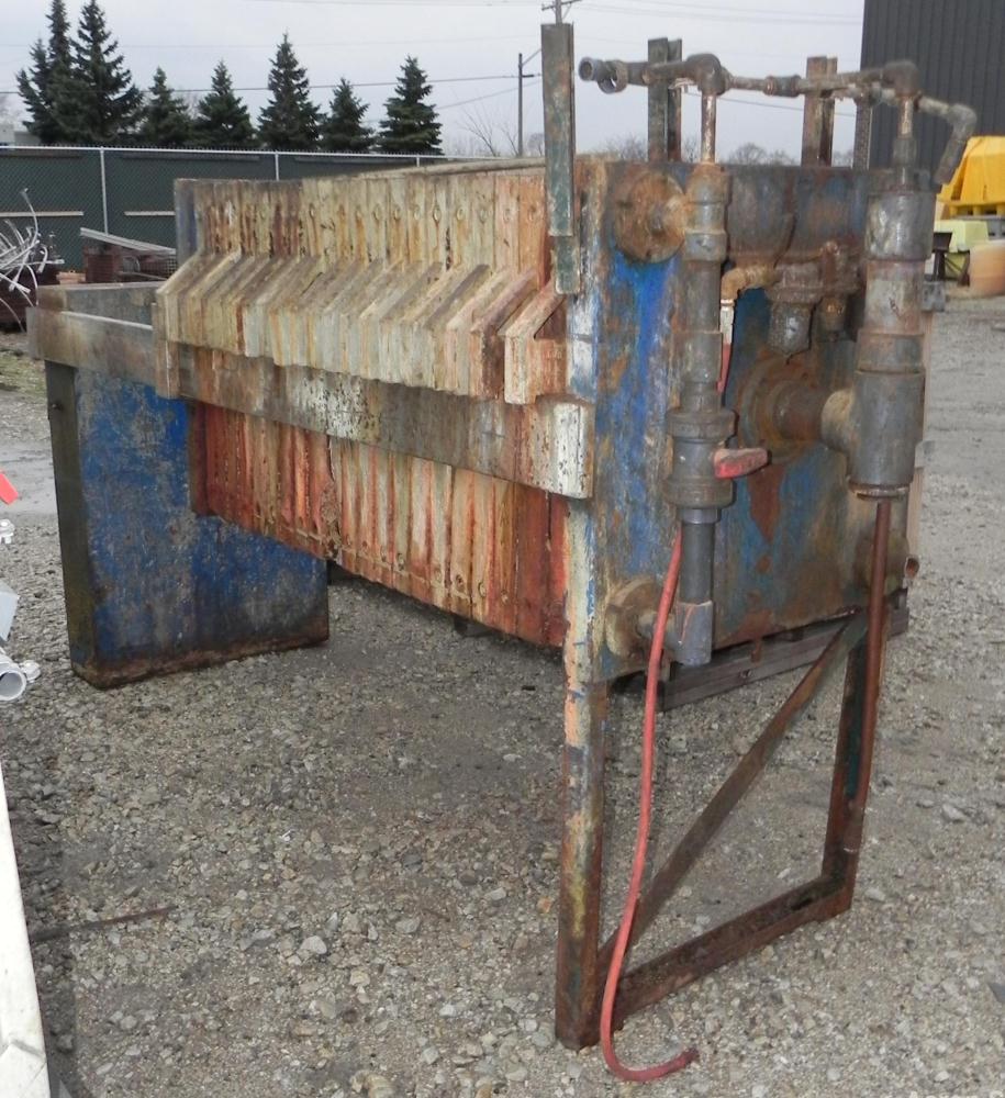 Used Filter Press, 32" x 32". (21) Polypropylene plates, approximately 142.2 square feet filter area, 5.93 cubic feet cake capacity. (1) Head, (1) tail. Hydraulic closure device, center feed, four co...