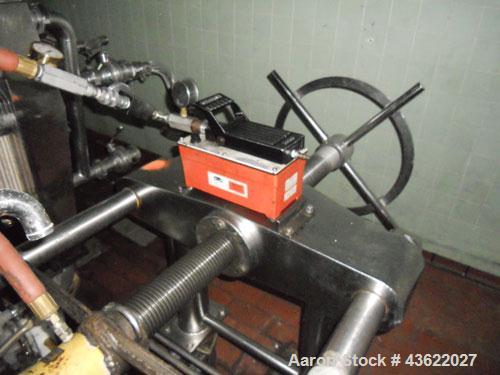 Used Schenk Stainless Steel Sanitary Filter Press. Approximately 60 stainless steel plates. 24" x 24". Hydraulic closure. Drip pan with Wilden Plastic diaphragm pump. Sanitary fittings. Mounted on wh...