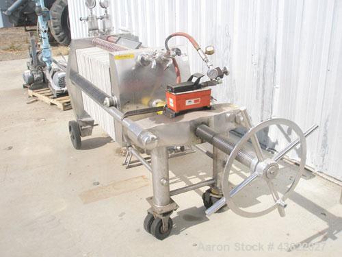 Used Schenk Stainless Steel Sanitary Filter Press. Approximately 60 stainless steel plates. 24" x 24". Hydraulic closure. Drip pan with Wilden Plastic diaphragm pump. Sanitary fittings. Mounted on wh...