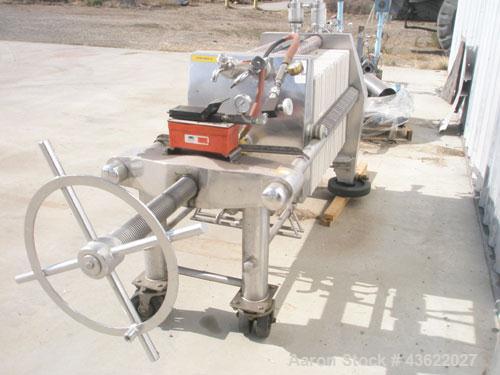 Used Schenk Stainless Steel Sanitary Filter Press. Approximately 60 stainless steel plates. 24" x 24". Hydraulic closure. Drip pan with Wilden Plastic diaphragm pump. Sanitary fittings. Mounted on wh...