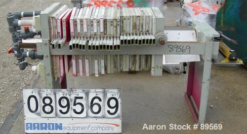 USED: Plate and frame filter press. 15 polypropylene plates 18" x 18" and 13 frames 18" x 18", 1" thick. Approximate 40 square feet capacity, approximate 1.47 cubic feet capacity. Corner feed, corner...