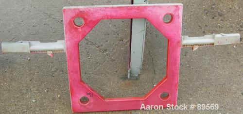 USED: Plate and frame filter press. 15 polypropylene plates 18" x 18" and 13 frames 18" x 18", 1" thick. Approximate 40 square feet capacity, approximate 1.47 cubic feet capacity. Corner feed, corner...
