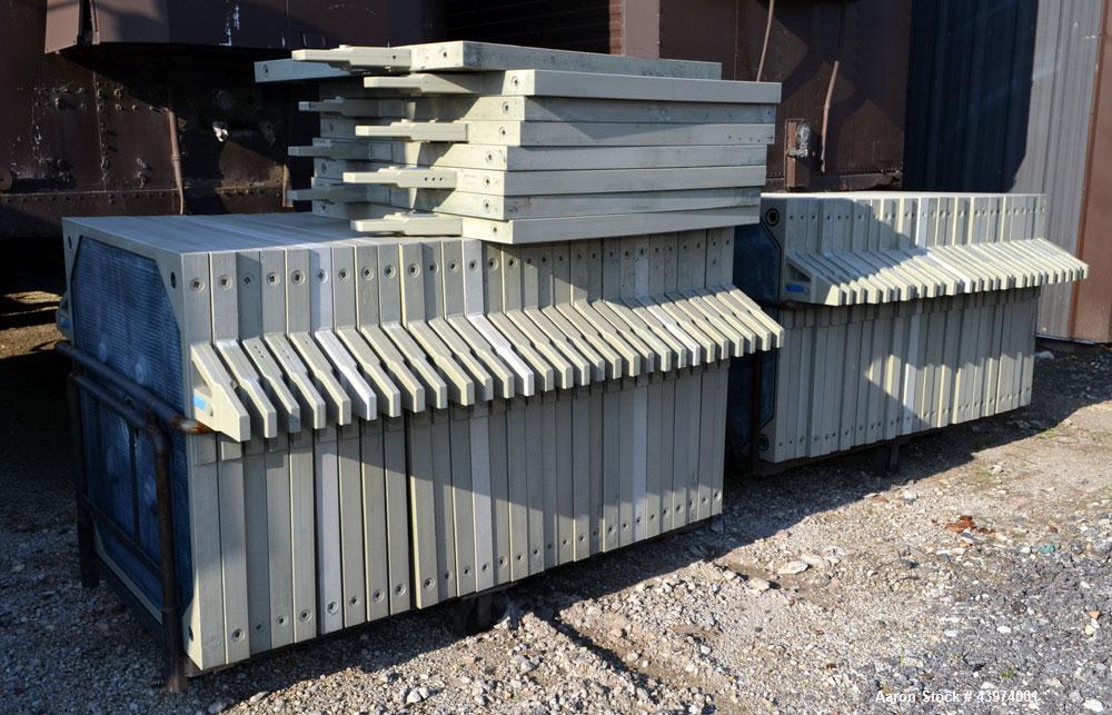 Used Beckart Environmental Hy-Pack Filter Press, Model 1000-40(60)A.  Carbon steel frame, (64) 39-1/4" x 39-1/4" x approximately 1/2" recess polypropylene plates, (1) head, (1) tail plate. Approximat...
