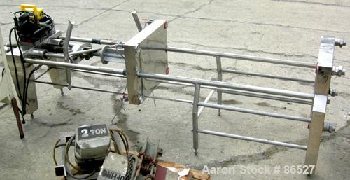 USED: Carlson Ford Ltd polishing press skeleton (frame only). Requires 22" x 22" plates. 2" corner feed/discharge, Enerpac hydraulic closing device. Unitized on a stainless steel clad frame.