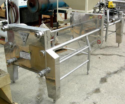 USED: Carlson Ford Ltd polishing press skeleton (frame only). Requires 22" x 22" plates. 2" corner feed/discharge, Enerpac hydraulic closing device. Unitized on a stainless steel clad frame.