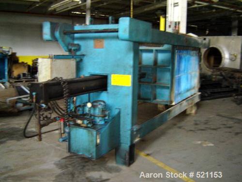 USED: Duriron plate and frame filter press with mild steel frame, hydraulic ram closure and approximately 40" x 40" plates.