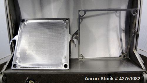 Used Ertel Vapor-Master Enclosed Plate & Frame Filter Press, Model EUS-O, 316 Stainless Steel. (5) Plates, (6) Frames, (1) Spacer, (1) head, (1) tail. Manual ratchet closure. Approximate (0.26) cubic...