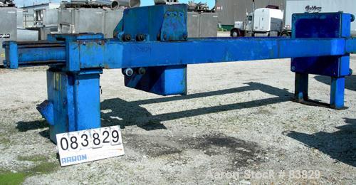 USED: JWI filter press, carbon steel frame. (83) 48" x 48" polypropylene plates, approximately 1300 square feet filter area, approximately 135 cubic feet cake capacity, 100 psi max filter pressure, h...