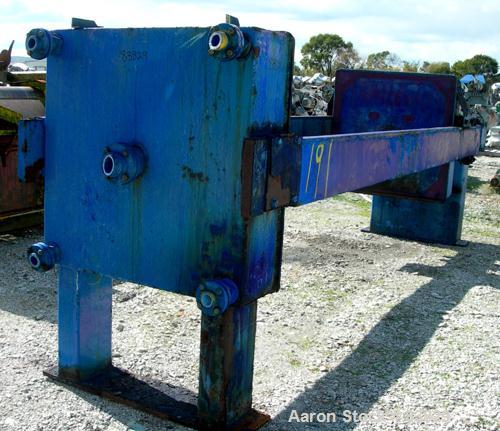 USED: JWI filter press, carbon steel frame. (83) 48" x 48" polypropylene plates, approximately 1300 square feet filter area, approximately 135 cubic feet cake capacity, 100 psi max filter pressure, h...