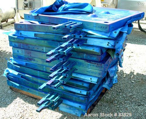 USED: JWI filter press, carbon steel frame. (83) 48" x 48" polypropylene plates, approximately 1300 square feet filter area, approximately 135 cubic feet cake capacity, 100 psi max filter pressure, h...