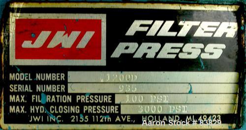 USED: JWI filter press, carbon steel frame. (83) 48" x 48" polypropylene plates, approximately 1300 square feet filter area, approximately 135 cubic feet cake capacity, 100 psi max filter pressure, h...