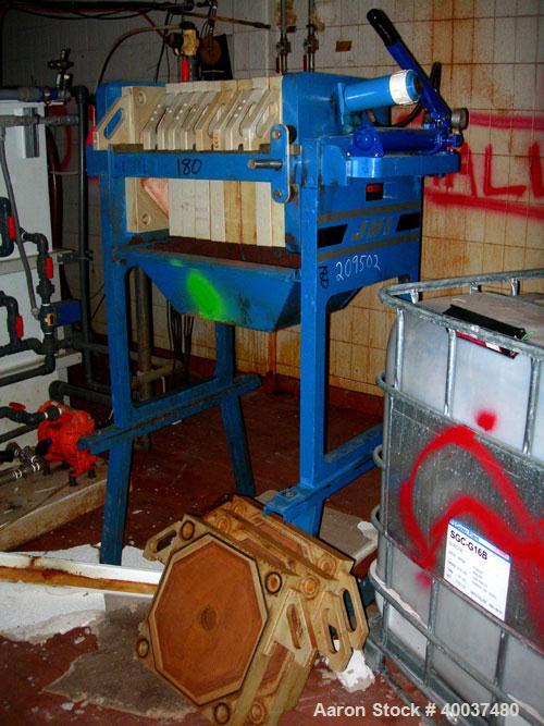 Used: JWI filter press, model 470G30-6-1-NA. (10) 18" X 18" X 2 1/2" thick x 1/2" recess polyproplene plates, (1) head, (1) tail plate. Approximately 21 square feet filter area, and 1 cubic feet cake...