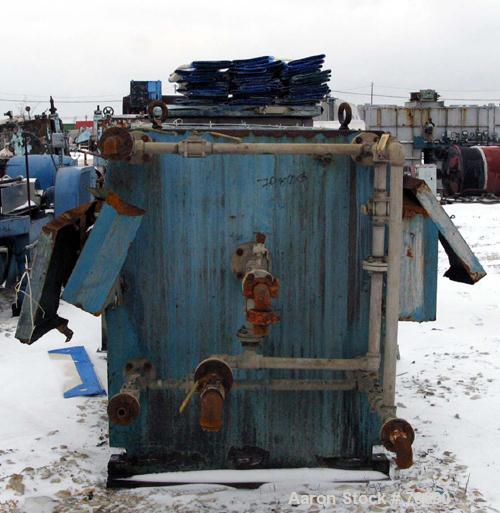 USED: Perrin plate and frame filter press, model 215-FL-51, cast iron frame. (48) 48" x 48" polypropylene plates, 1 end plate. 645 square foot filter area, 53 cubic foot cake capacity, center feed, 4...