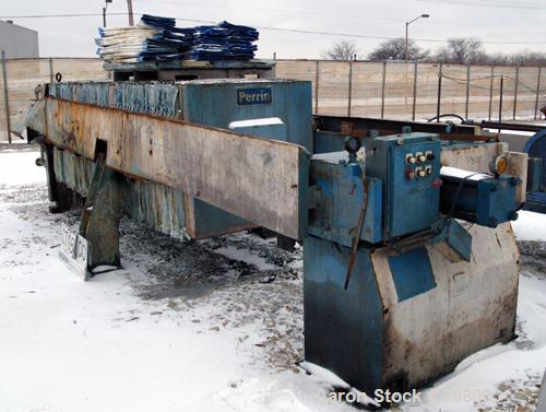 USED: Perrin plate and frame filter press, model 215-FL-51, cast iron frame. (48) 48" x 48" polypropylene plates, 1 end plate. 645 square foot filter area, 53 cubic foot cake capacity, center feed, 4...