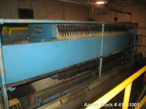 Used Perrin 1000 mm Filter Press. Press consists of 45 polypropylene filter plates. Top center feed, 4 corner discharge. 1-3/16" cake thickness. Approximately 40 cubic foot cake capacity. Approximate...