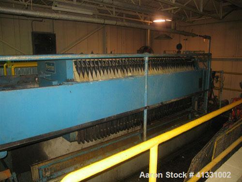 Used Perrin 1000 mm Filter Press. Press consists of 45 polypropylene filter plates. Top center feed, 4 corner discharge. 1-3/16" cake thickness. Approximately 40 cubic foot cake capacity. Approximate...