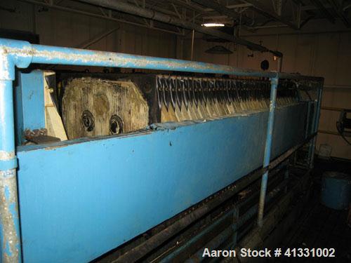 Used Perrin 1000 mm Filter Press. Press consists of 45 polypropylene filter plates. Top center feed, 4 corner discharge. 1-3/16" cake thickness. Approximately 40 cubic foot cake capacity. Approximate...