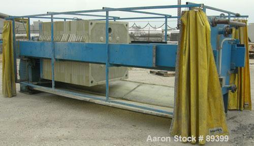 USED: Perrin filter press, (50) 59" x 59" polypropylene plates, approximate 1" cake. Approximate 82.69 cubic feet cake capacity, approximate 992.25 square feet of filter area. 3000 PSI cylinder closi...