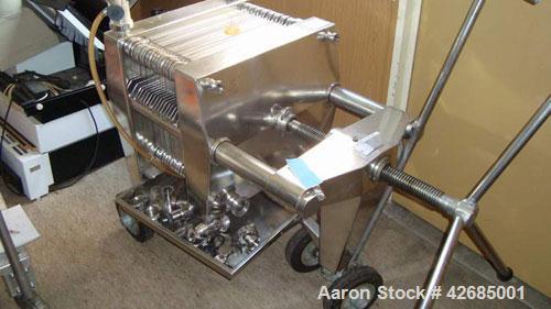 Used Seitz Polishing Press, 316 Stainless Steel. (15) stainless steel plates approximately 15" (400 MM) x 15" (400 MM), 1/2" thick, 1 head, 1 tail. Approximate 24.2 square feet filter area, approxima...
