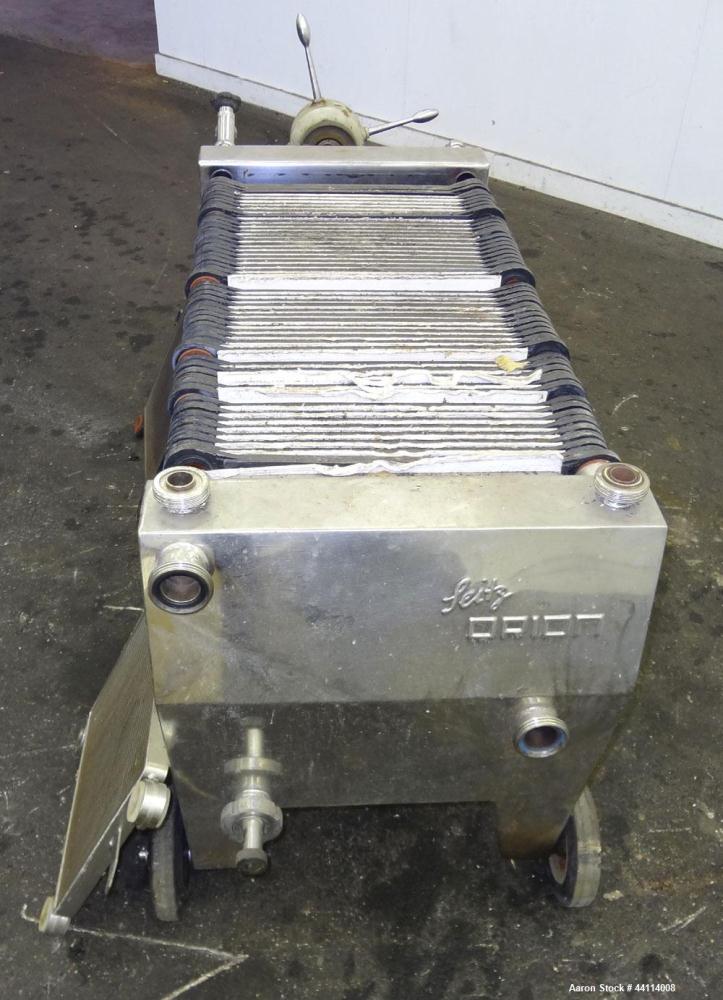 Used Seitz Werke Polishing Press, Type 40/60. Has (57) 15" X 15" plastic Plates, (1) head, (1) tail that are stainless steel. Approximate (90.48) square feet filter area. (4) corner feed, and dischar...