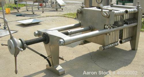 Used Seitz Orion plate and frame filter press, type 60A80, 316 stainless steel. (11) 22 3/4" X 22 3/4" 1/2 thick plates, (11) 22 3/4" x 22 3/4" 1 1/2" thick frames, (1) head, (1) tail plate. Approxim...