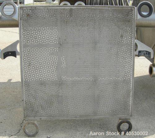 Used Seitz Orion plate and frame filter press, type 60A80, 316 stainless steel. (11) 22 3/4" X 22 3/4" 1/2 thick plates, (11) 22 3/4" x 22 3/4" 1 1/2" thick frames, (1) head, (1) tail plate. Approxim...