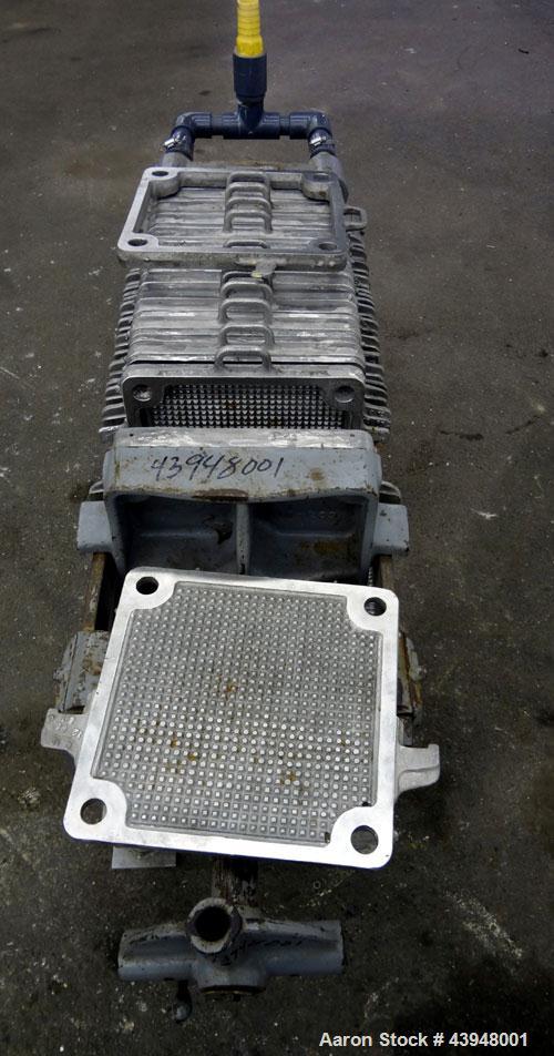 Used T. Shriver Filter Press, Size 12, 316 Stainless Steel.  (12) 12" x 12" x 1” thick frames, (14) 12” x 12” x 1/2” thick plates, (1) end frame.  Approximately 22 square feet filter area, 0.91 cubic...