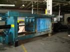 USED: Duriron plate and frame filter press with mild steel frame, hydraulic ram closure and approximately 40