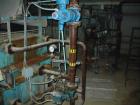 USED: Edwards and Jones filter press. 1200mm x 1200mm polypropylene plates, 36 plates. Approximately 500 sq ft of filtration area. Press includes a plate shifter. Center feed corner discharge, hydrau...
