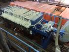 Used JWI Filter Press. 10 cubic foot, elevated stand for roll of box. Press has 800 mm plates, 23 plates plus head and tail.