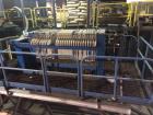 Used JWI Filter Press. 10 cubic foot, elevated stand for roll of box. Press has 800 mm plates, 23 plates plus head and tail.