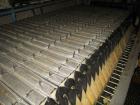 Used Perrin 1000 mm Filter Press. Press consists of 45 polypropylene filter plates. Top center feed, 4 corner discharge. 1-3/16