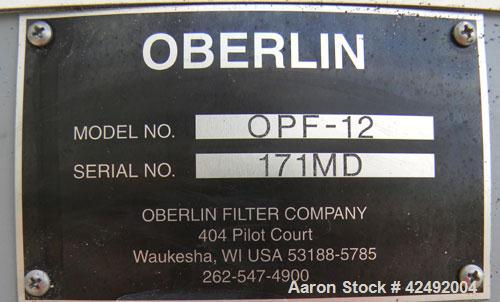 Used Oberlin Automatic Pressure Filter, Model OPF-12, Carbon Steel. 12 Square feet filter area. Approximate press area 36" x 48". End discharge. Cloth advance driven by a 1/2 hp, 3/60/230/460 volt, 1...