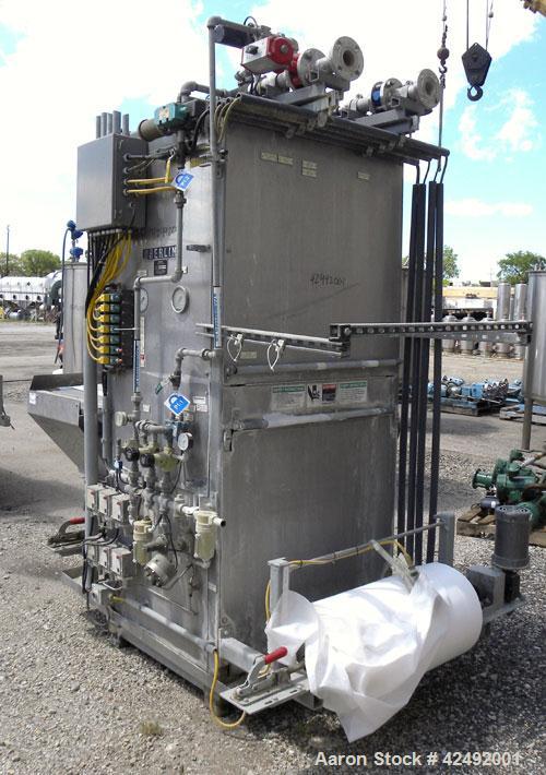 Used Oberlin Automatic Pressure Filter, Model OPF 4 Carbon Steel. 4 Square feet filter area. Approximate press area 24" x 28". End discharge. Cloth advance/roll up each driven by a 1/4 hp, 3/60/208-2...